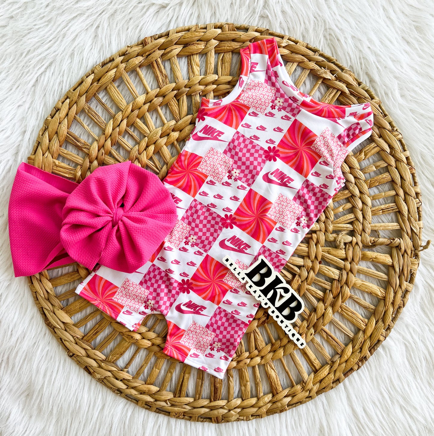 Checkered pink swoosh Ollie romper