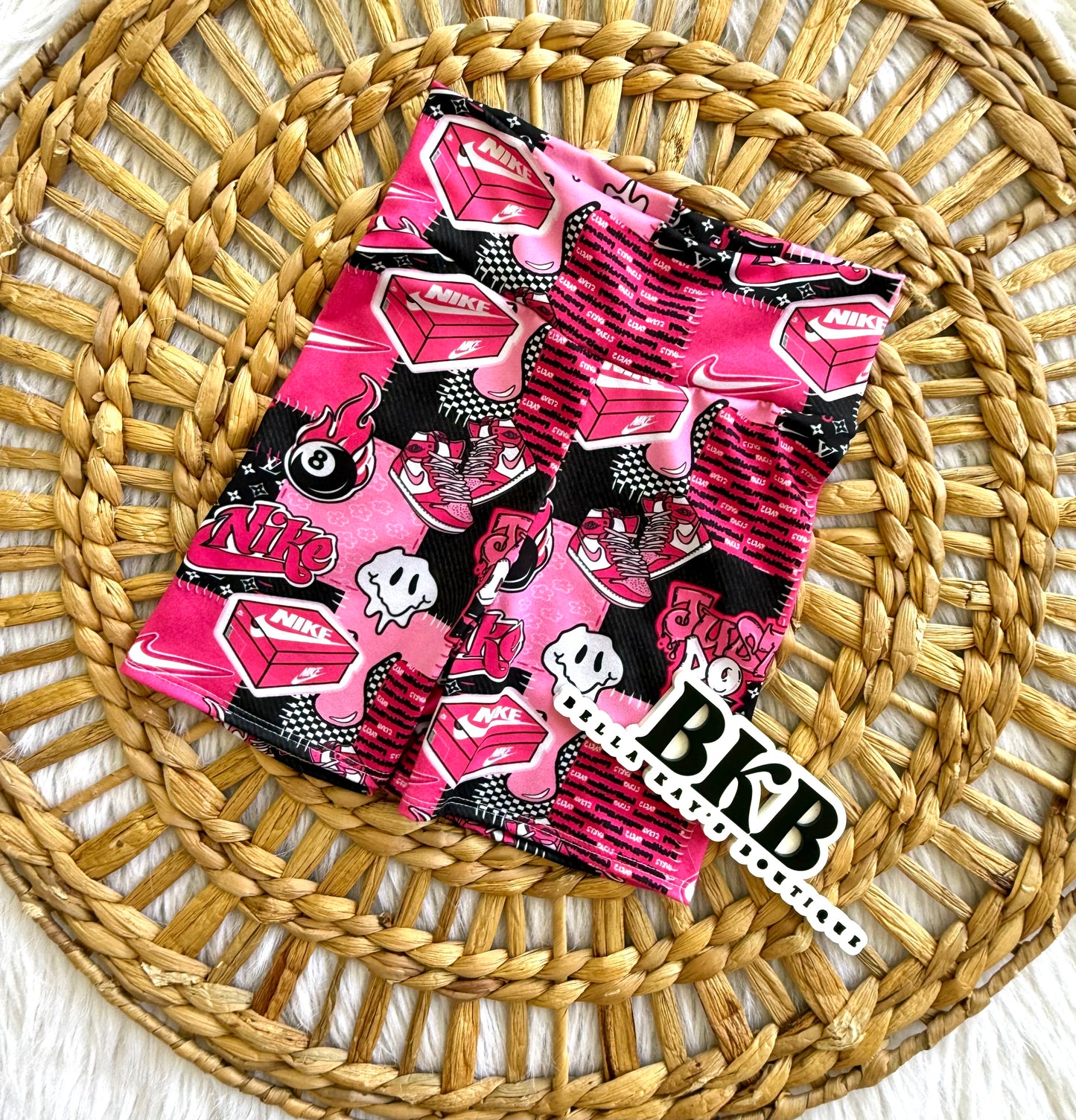 6/7 black & pink swoosh bikers shorts